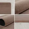 A collage of close-up shots of a brown rug, showing its texture and edges. Podgląd zdjęcia produktu