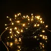 A close-up shot of a tangled string of warm white LED lights against a dark background. Náhled obrázku produktu