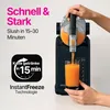 A person is using a slush maker to pour a drink into a glass. Produktbild-Vorschau