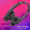 A close-up shot of black Bluetooth headphones against a vibrant pink and purple gradient background, with a blurred image of a person in the background. Náhľad obrázku produktu