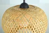 Close-up view of a woven bamboo lampshade. Produktbild-Vorschau