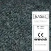 A close-up of carpet tiles with a label showing product information and certifications. Náhled obrázku produktu