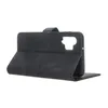 A black flip case for a smartphone is shown from a side angle, with the cover open. Produktbild-Vorschau