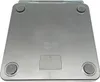 The underside of a digital scale is shown against a white background. Produktbild-Vorschau