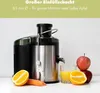 A Clatronic juicer is shown with fruits and vegetables, along with a glass of juice. Produktbild-Vorschau