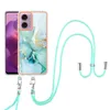 A phone case with a marble pattern and a mint green lanyard is shown against a white background. Náhled obrázku produktu