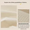 Close-up of fabric texture and silicone anti-slip particles on the bottom of a sofa cover. Produktbild-Vorschau