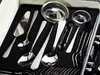 A set of silverware is neatly arranged in a black velvet-lined case. Produktbild-Vorschau