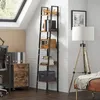 A modern office or living space with a ladder bookshelf, filing cabinet, and floor lamp. Podgląd zdjęcia produktu