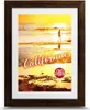 A framed poster of a California beach sunset with a person walking on the shore. Produktbild-Vorschau