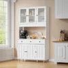 A white sideboard with glass doors in a kitchen or dining room setting. Náhled obrázku produktu