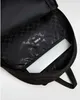 The inside of a black backpack with a laptop inside. Náhľad obrázku produktu