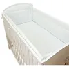 A white baby crib with a white mattress and bumper pad. Produktbild-Vorschau