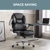 A black executive chair is shown in an office setting with a desk and laptop in the background. Produktbild-Vorschau