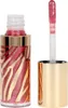 A close-up product shot of a lip gloss bottle and its applicator. Podgląd zdjęcia produktu