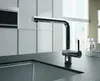 A modern kitchen sink faucet with a pull-out spout, set against a backdrop of kitchen cabinetry and a window with blinds. Produktbild-Vorschau