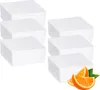 A group of white dehumidifier refills with orange slices and leaves in the foreground. Produktbild-Vorschau