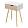 A white and wood bedside table with three wooden legs, shown against a white background. Náhled obrázku produktu
