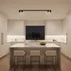 A modern kitchen with a central island and a large window overlooking a city skyline at night. Náhľad obrázku produktu