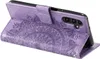 A purple flip case for a Samsung Galaxy A34 5G phone, with a mandala design embossed on the cover. The phone is inside the case, and the case is open, showing the phone's camera. Produktbild-Vorschau