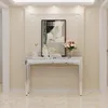 A console table with decorative items and flowers on it, placed in a hallway or living room. Anteprima dell’immagine prodotto