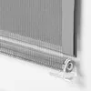 A close-up view of a gray roller blind with a transparent bracket. Produktbild-Vorschau