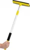 A hand holding a yellow and silver window squeegee with an extendable handle against a white background. Podgląd zdjęcia produktu