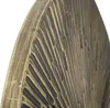 Close-up view of a decorative wall clock's textured surface. Náhľad obrázku produktu