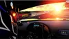 View from inside a race car cockpit during a sunset race. Produktbild-Vorschau