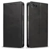 A black leather flip cover phone case shown from two angles. Produktbild-Vorschau