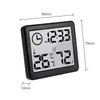 A digital thermometer and hygrometer with a clock function, displaying temperature, humidity, and time. Anteprima dell’immagine prodotto