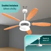 An exploded view of a ceiling fan with its blades and light fixture detached, illustrating assembly and mounting options. The background shows a room interior, and a separate inset shows the fan mounted at an angle. Náhled obrázku produktu