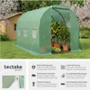 A green tunnel-shaped greenhouse with potted lemon trees inside, set in a grassy garden next to a wooden shed. Náhled obrázku produktu