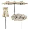 Three views of a beige double patio umbrella against a white background. Produktbild-Vorschau