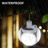 A solar-powered LED lantern hanging outdoors in the rain. Anteprima dell’immagine prodotto