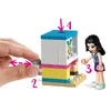 A hand is shown interacting with a LEGO cupcake cafe set, with a LEGO figure nearby. Náhled obrázku produktu