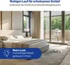 A bedroom with a bed, a fan, and large windows. Podgląd zdjęcia produktu