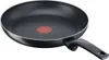 A black frying pan with a red heat indicator in the center and a black handle, shown from a diagonal angle against a white background. Produktbild-Vorschau