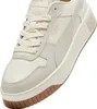 A close-up, angled view of a Puma Carina Street sneaker. Produktbild-Vorschau
