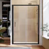 A modern bathroom with a black framed sliding shower door, tiled walls, and a closet with folded clothes visible. Produktbild-Vorschau