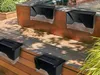 Solar-powered garden lights mounted on a wooden deck and railing. Podgląd zdjęcia produktu