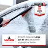 A person is using a snow brush to clear snow from a car window. Náhľad obrázku produktu