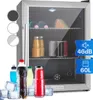 A mini-fridge is shown with various drinks and ice cubes in front of it. Inside the fridge, there are bottles of juice, cans, and a wedge of cheese. Podgląd zdjęcia produktu