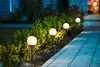 A row of garden lights illuminating a pathway at dusk. Produktbild-Vorschau