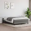 A bedroom scene with a bed, artwork, and a plant. Náhled obrázku produktu