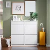 A hallway or entryway with a white shoe cabinet, a basket, and an umbrella stand. Náhľad obrázku produktu