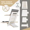 A white and wood laptop stand is shown assembled with a laptop and mouse, and also disassembled into its four component parts. Produktbild-Vorschau