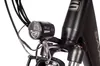 A close-up view of the front light and part of the frame of a black electric bicycle. Produktbild-Vorschau