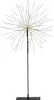 A black starburst-shaped LED light on a black stand against a white background. Produktbild-Vorschau