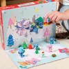 A person's hand is opening an advent calendar with Stitch characters. Produktbild-Vorschau